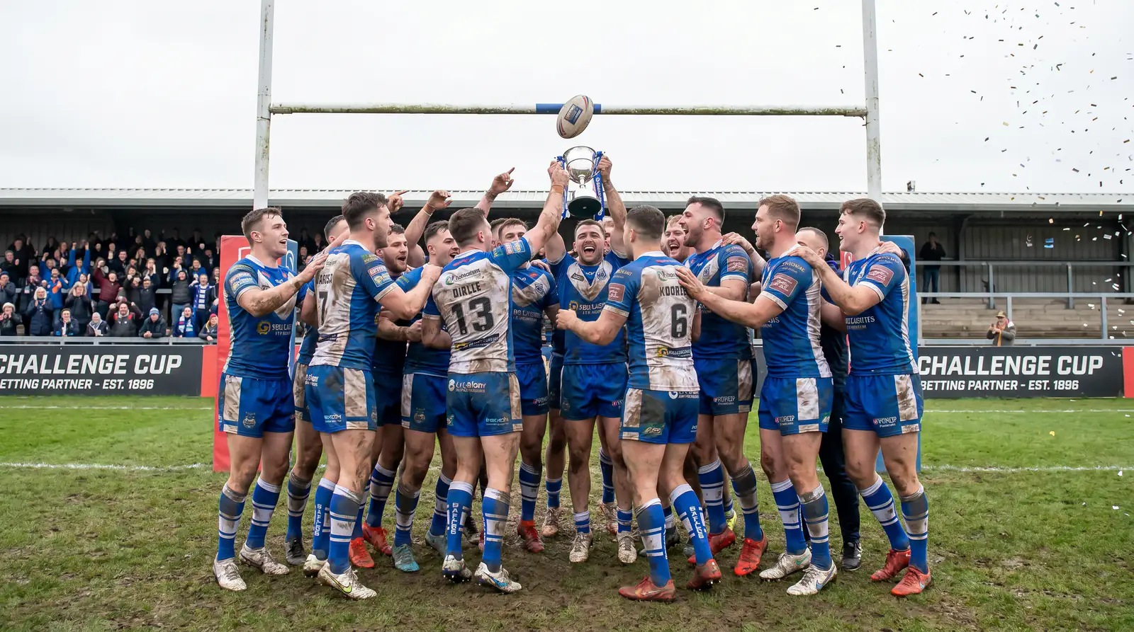 Championship-level rugby league side celebrating cup upset on home ground