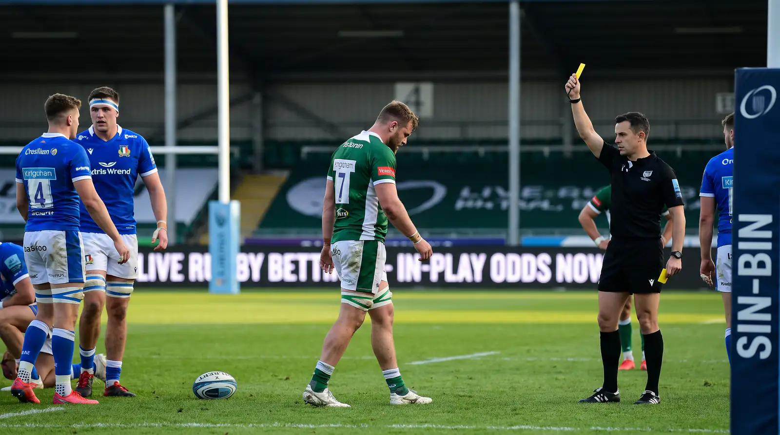 Referee showing yellow card to rugby player heading to sin-bin
