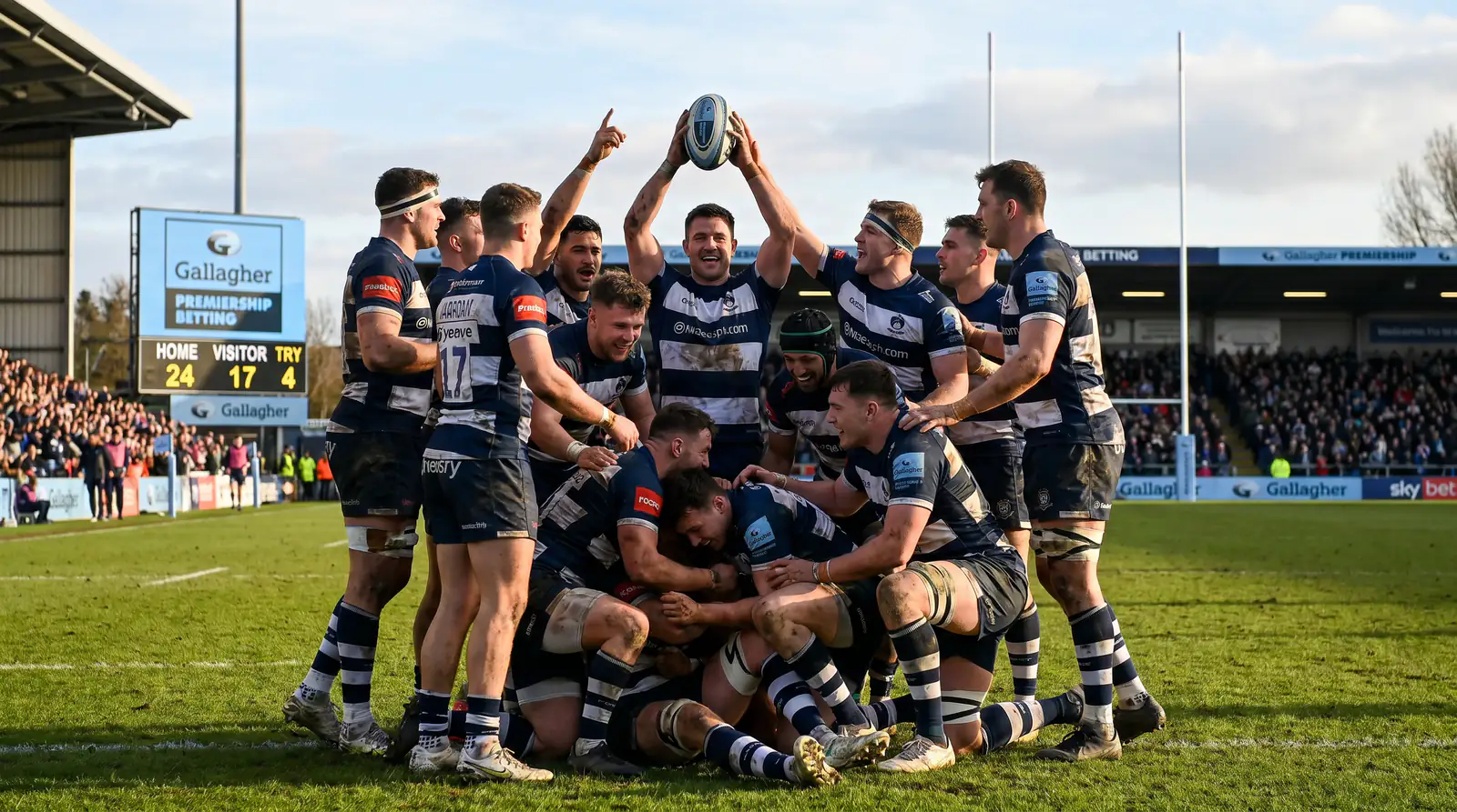 Premiership rugby team celebrating fourth try scored for bonus point