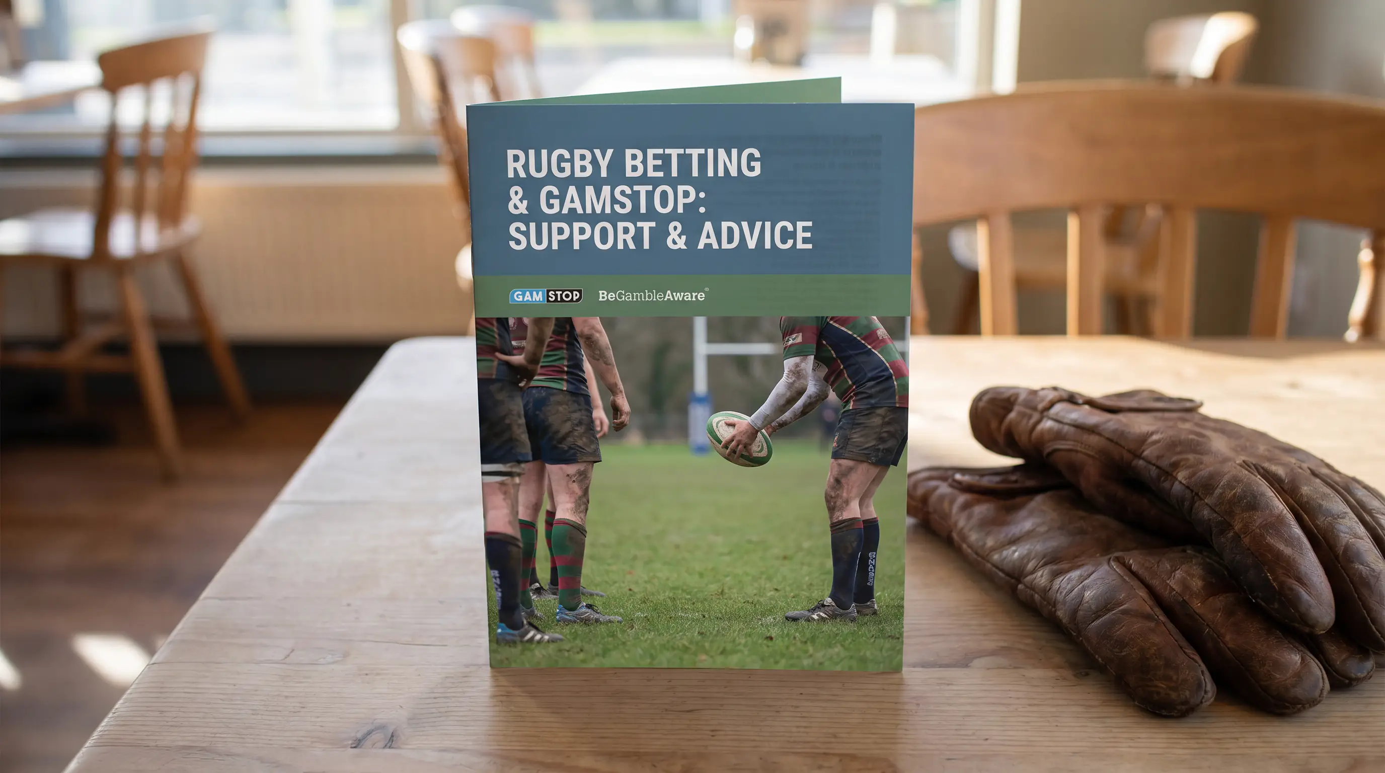 UK gambling support helpline information leaflet on table